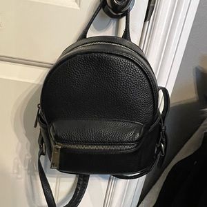 Black and gold leather mini backpack